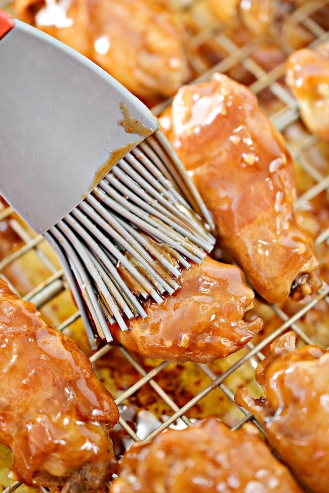 basting the keto chicken wings