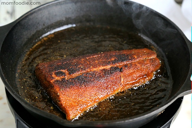 blackened salmon fillet in cast iron skillet
