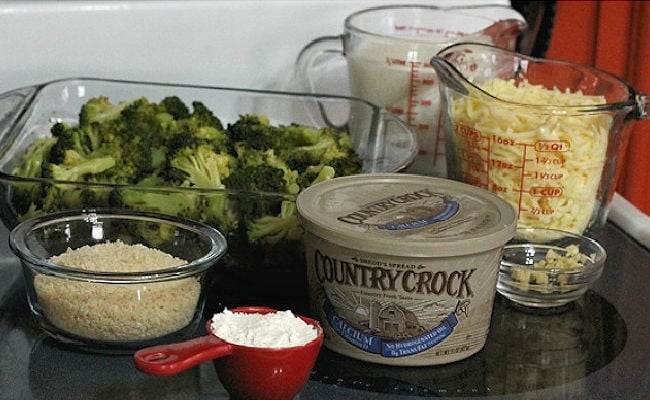 Ingredients Broccoli au Gratin, broccoli and cheese casserole, set out on stove top.