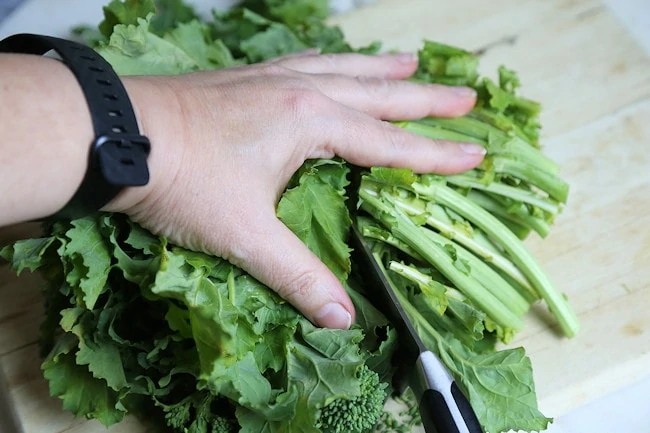 chopping broccoli rabe