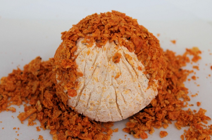 coating Pumpkin Cheese Ball with chips