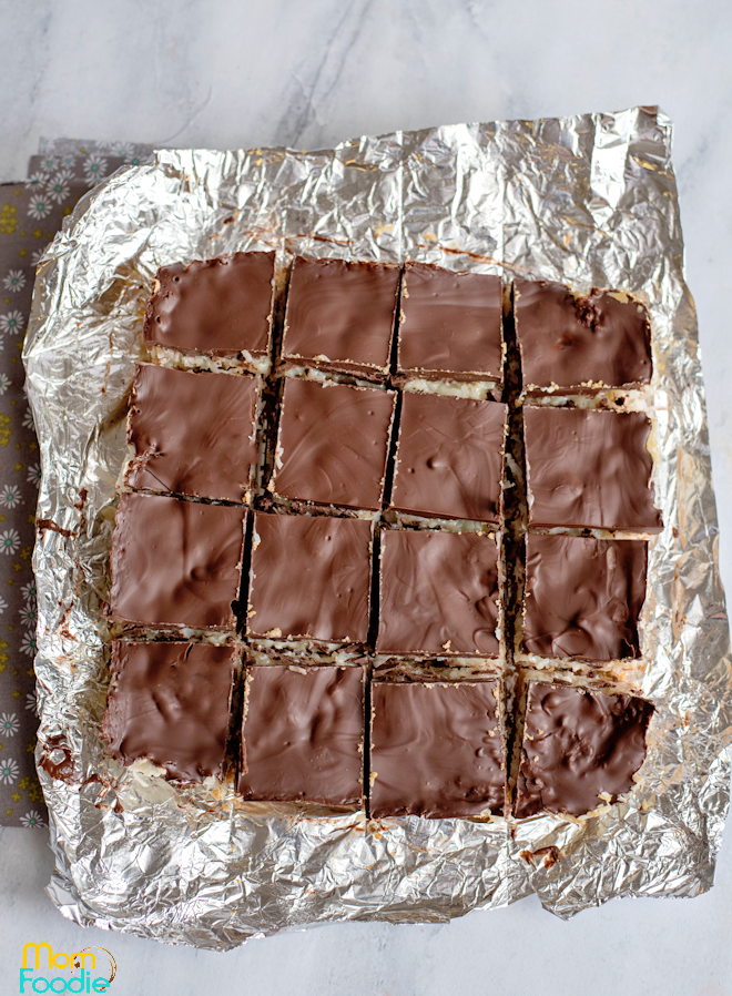 coconut bars cutting into squares.