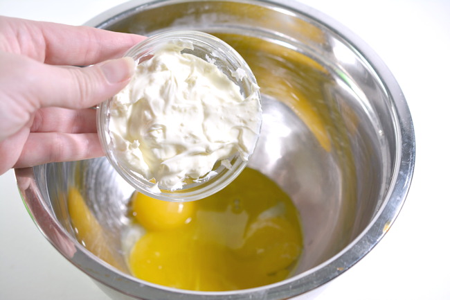 combine softened cream cheese and egg yolks