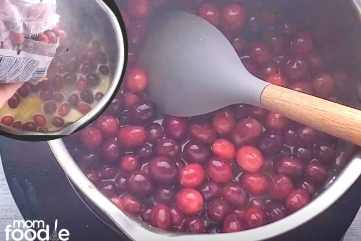 add cranberries to pot (inset) Fresh cranberries orange spiced juice and sugar combined in pan boiling.