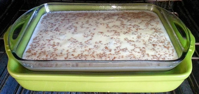 grape nut pudding in hot water bath made with two baking dishes