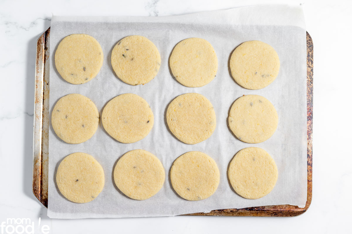 freshly baked lavender lemon cookies on cookie sheet