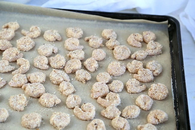 popcorn shrimp on baking sheet