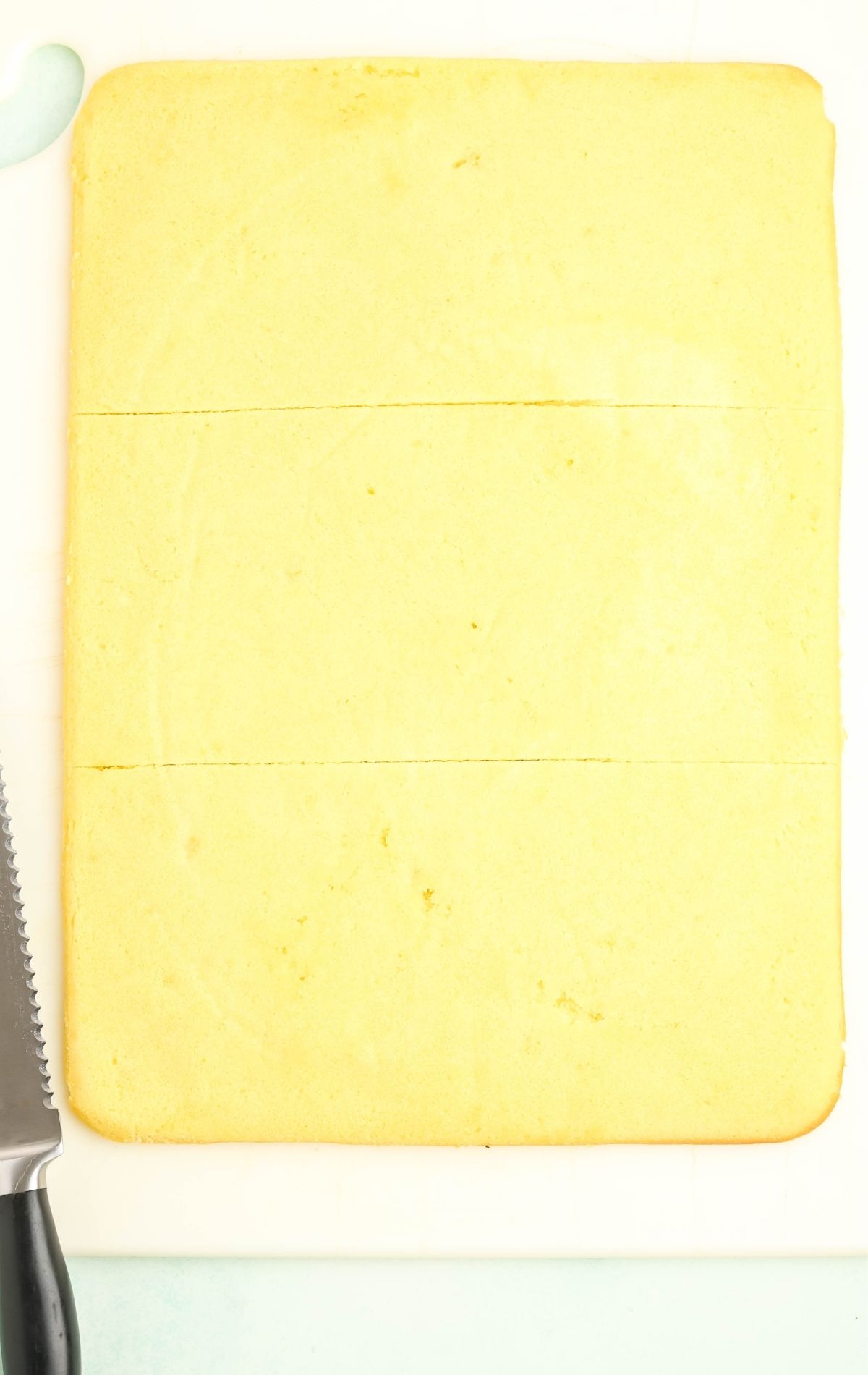 cut the sheet of pound cake into thirds to create the petit four layers