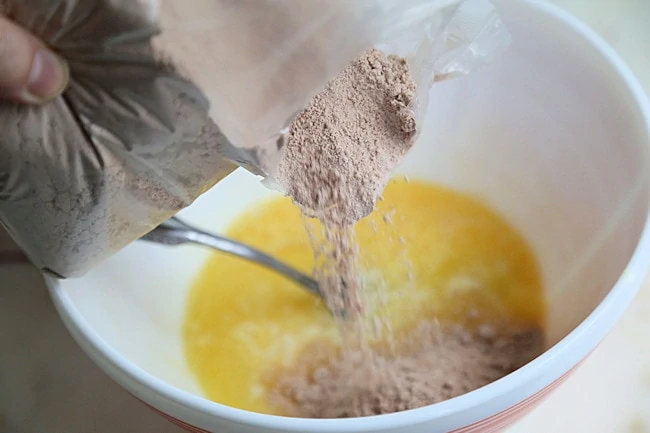 red velvet cake mix added to bowl