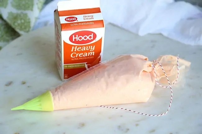 salmon mousse in piping bag
