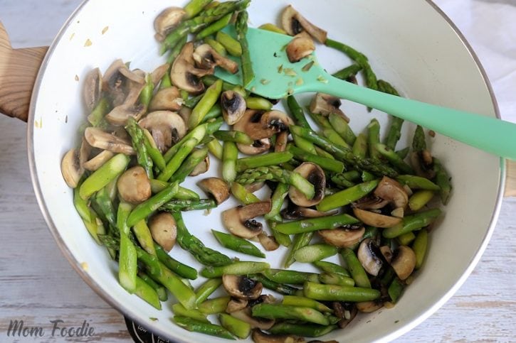 sauteed asparagus and mushrooms in pan