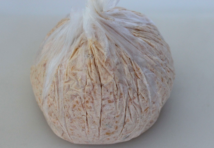 shaping pumpkin cheese ball with plastic wrap