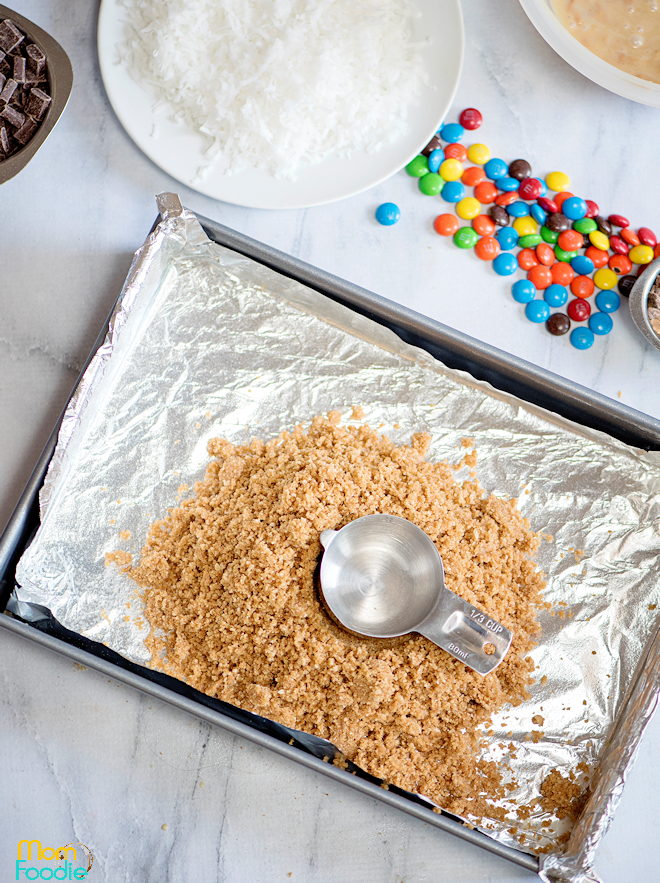 spread crumbs in pan