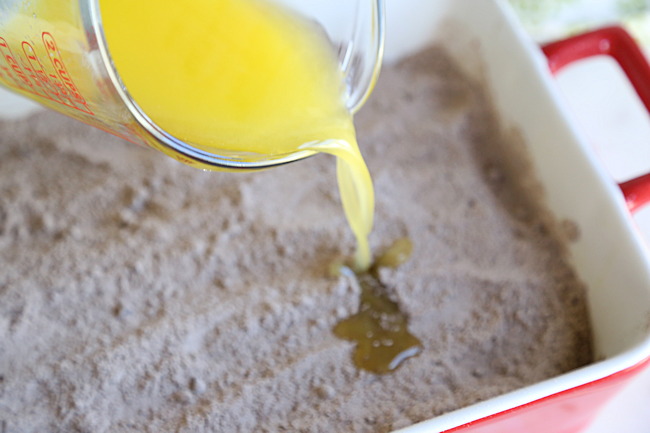 topping the cake mix layer with butter