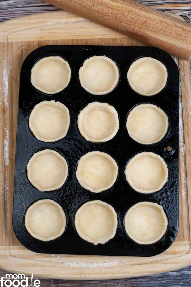 shape mini pie crusts in muffin cups